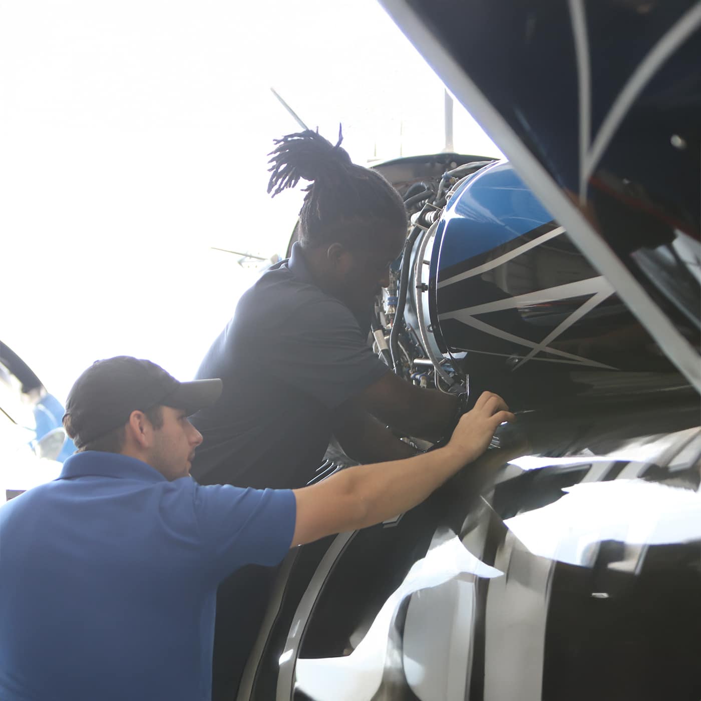 2 technicians working on cirrus aircraft repair