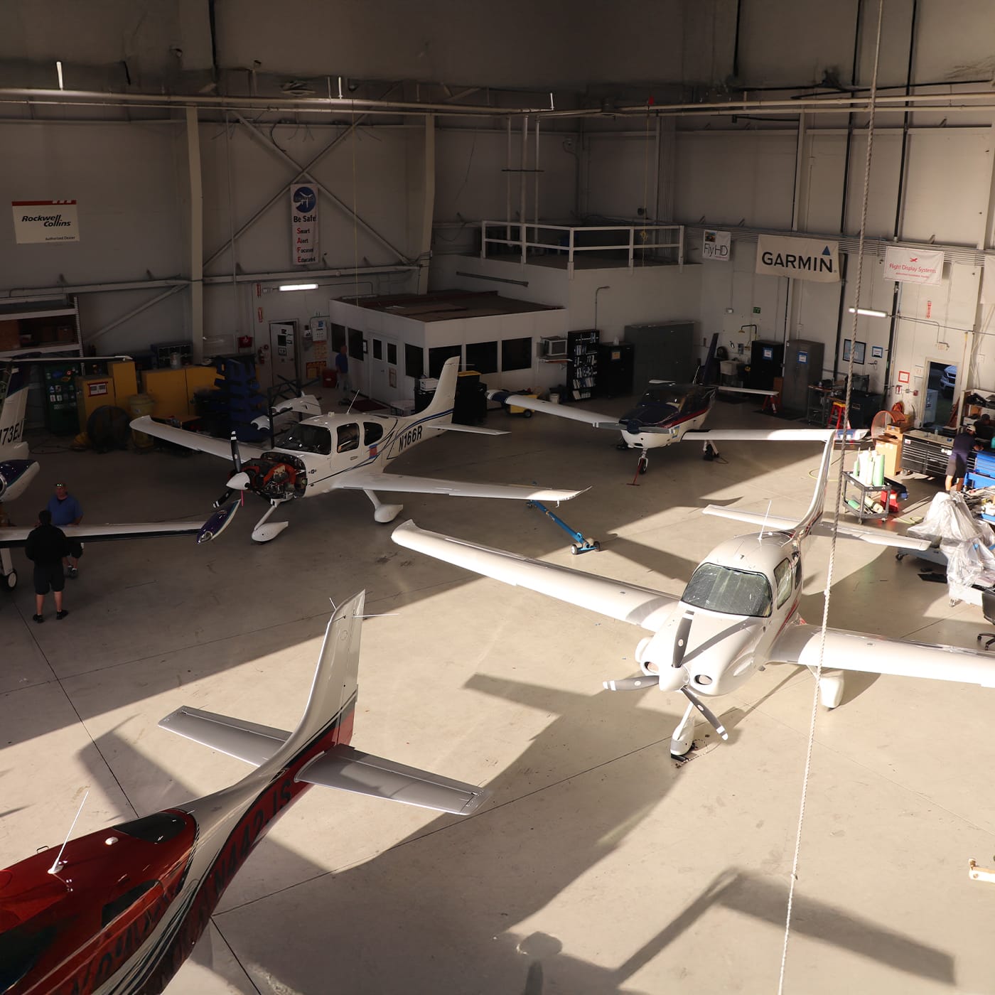 Cirrus aircraft inside hanger top view
