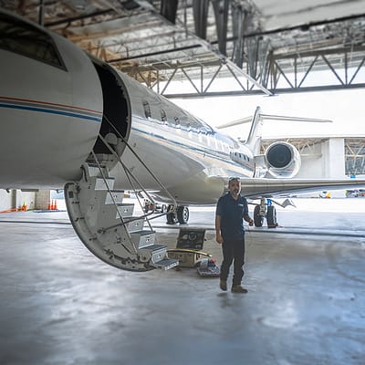 Global Express jet mechanic in front