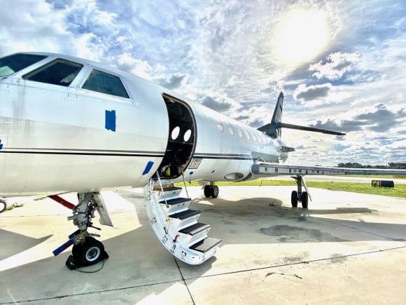 Falcon 50 on tarmac with open door